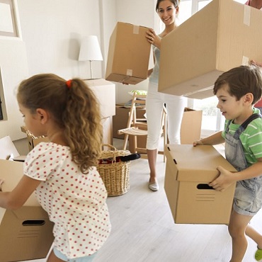 family-carrying-moving-boxes-r